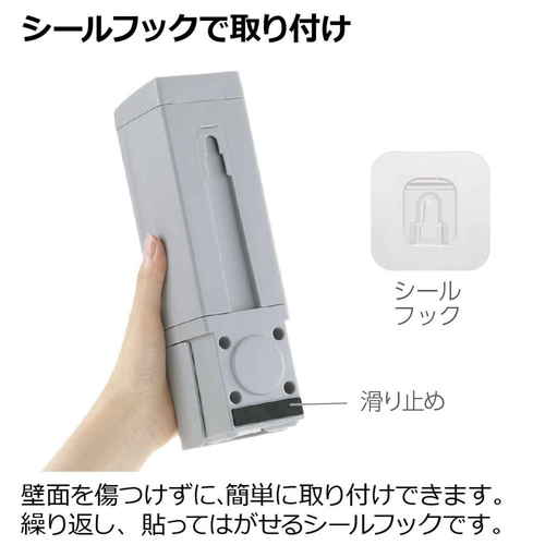 ディスペンサー　シールフック　下から出てくるディスペンサー　500ml　ホバー　グレー 底から内容が出る透明なディスペンサーが傾いている様子
