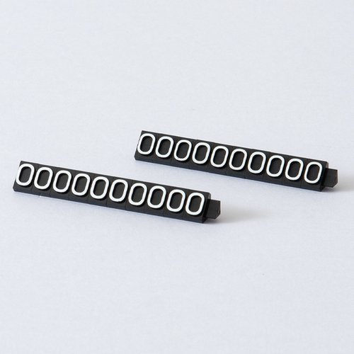 陳列備品 ニュープライスキューブ補充L用(20粒) 黒/白 0 友屋 黒と白の補充用パーツが並べられた透過パッケージ