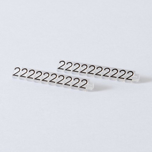 陳列備品 ニュープライスキューブ補充L用(20粒) 透明/黒 2 友屋 透明と黒の補充パーツが整然と並んでいる様子