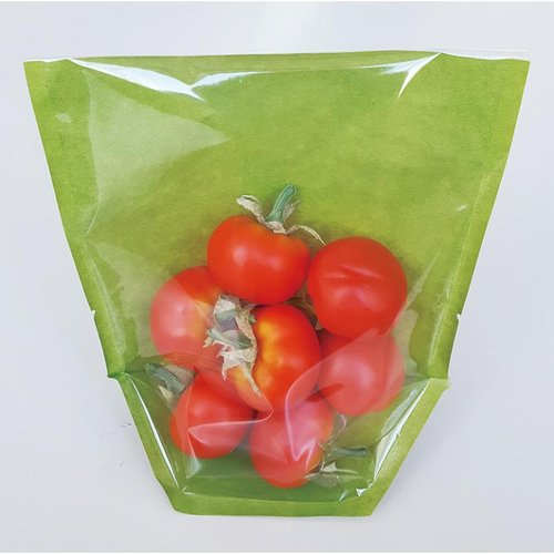 惣菜袋 KBカラフルデリ1 140×160 緑 コバヤシ 鮮やかな緑色の袋にデザインされたパターンが見える状態