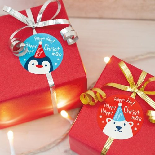 クリスマススノーベア シール-1/シロクマ(100枚) ヘッズ シロクマのキャラクターが楽しげにデザインされたシールが重なっている様子