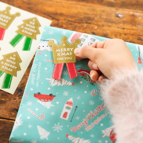 贈答用飾り クリスマスシール/オーナメント(100枚) ヘッズ 色とりどりのクリスマスシールが束ねられた様子