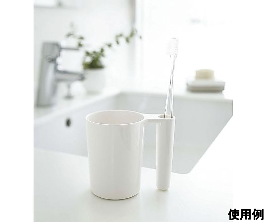 105x 70x 90mm タンブラー(歯ブラシスタンド付) 透明なタンブラーが歯ブラシスタンドと並んで置かれている様子