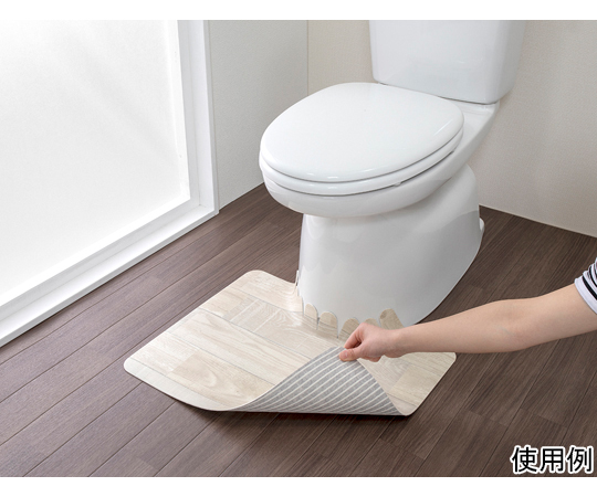 吸着拭けるフロアトイレマットウッド　ショート　ホワイト 柔らかな質感の白いマットが床に置かれ、フロアに吸着している様子