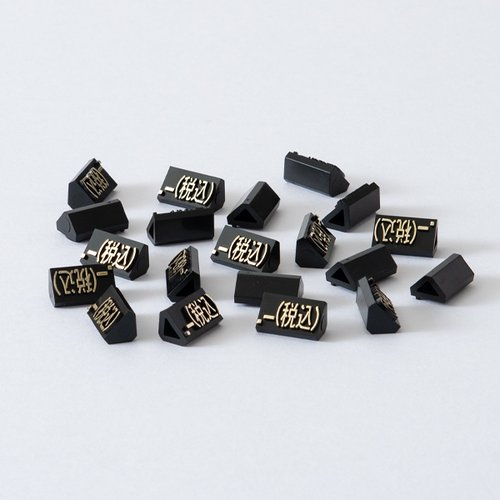 陳列備品 ニュープライスキューブ補充L用(20粒) 黒/金 税込 友屋 黒と金の配色のパッケージが整然と並んでいる状態