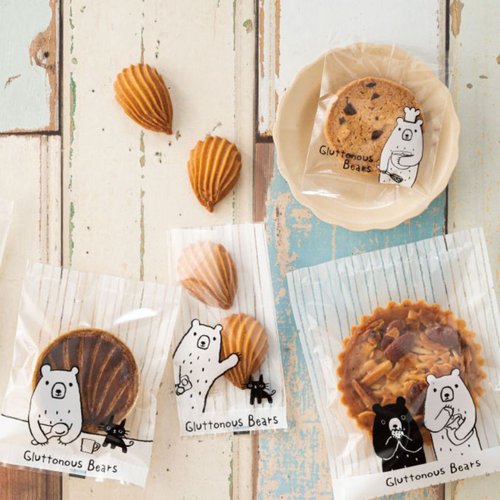 テープ無 OPP袋 グラットンベアスイーツパック クリア-2(100枚) ヘッズ 透明な袋に入ったスイーツのパッケージが横向きに並んでいる様子