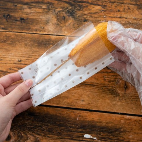 テープ無 OPP袋 和風ドットスイーツパック(茶) クリア-2(100枚) ヘッズ 透明なパックに入った和風ドットのスイーツパッケージが整然と並んでいる様子