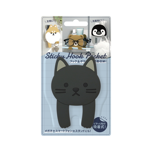 フック　吸着　スティッキーフックポケット　アニマル　クロネコ 黒猫の形をした吸着フックが壁に取り付けられ、愛らしい表情を見せている様子