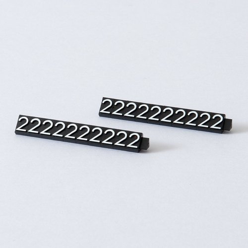 陳列備品 ニュープライスキューブ補充L用(20粒) 黒/白 2 友屋 黒と白のパッケージが整然と並んだ状態で、粒数が明記されている。