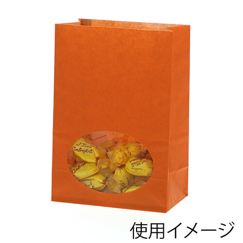 角底袋（窓付き・オレンジ・幅120×マチ65×高175mm) 前面の縦長透明窓から中身が一部見えるオレンジ色の自立する平底の袋が1つ立っている様子