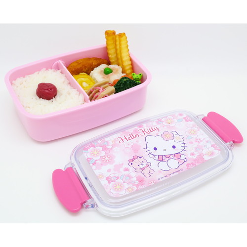 お弁当箱　1段　ハローキティ　サクラ　500ml　仕切り付　ランチボックス　子供 明るいピンク色のデザインとサクラ柄が施された正面のビュー、仕切りが見える状態。