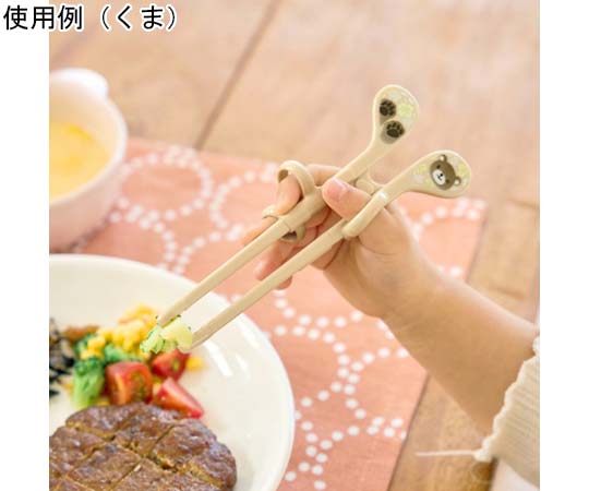エジソンのお箸mini（右手用）いぬ 12個入 鮮やかな色合いのパッケージがテーブルに置かれている様子