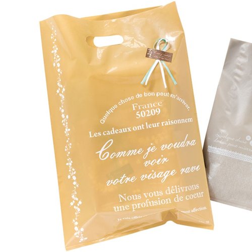 ポリ手提げ ナチュラルバインPEバッグ-4(100枚) ヘッズ 透明なプラスチックバッグが束ねられている様子
