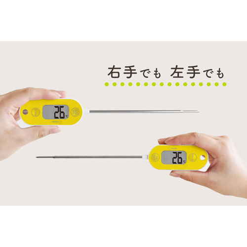 料理用温度計　防水クッキング温度計　イエロー 鮮やかなイエローの温度計がテーブルに置かれ、表示画面が正面を向いている様子