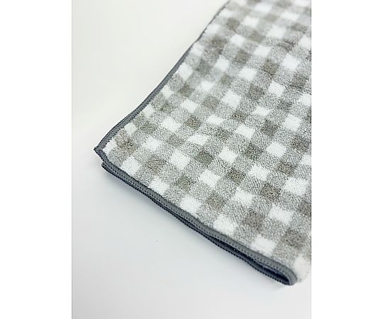 マイクロファイバーフェイスタオル2P ホリデー チェック 34×80cm BROWN 1セット（2枚×10袋入） 複数のタオルが整然とパッケージされている様子、チェック柄が際立つデザイン