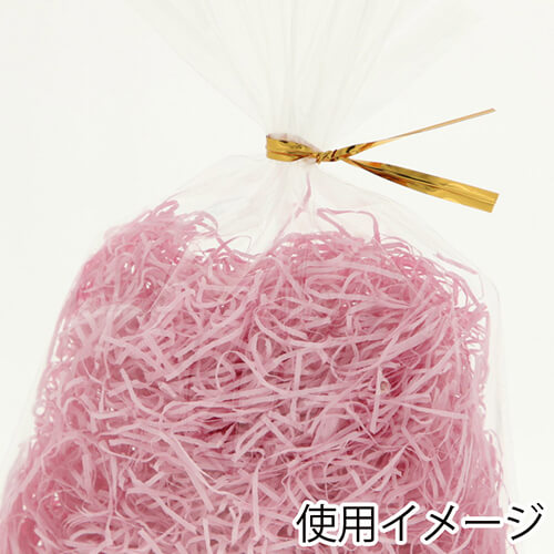 紙パッキン（ライトピンク・紙巾1mm・1kg/袋） 透明袋に詰められた1mm幅のライトピンクの細く裂かれた紙が詰まった様子