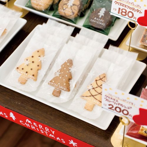 テープ無 OPP袋 ウィンタースノースイーツパック クリア-4(100枚) ヘッズ 透明な袋が数枚重なり、袋の口が開いた状態で見える