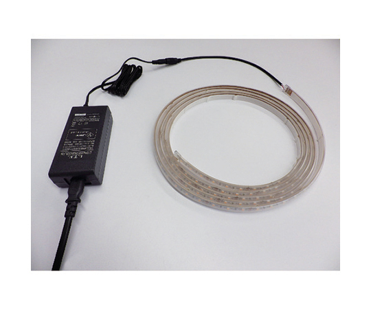 LEDテープライト Viewdi 16.6P 2700K 3m巻 ACアダプタ-付 透明のケースに収められた巻き取り式のテープが、明るい光を放つ様子