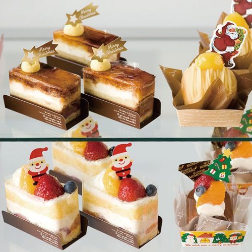 弁当ピック クリスマスケーキピック-ミニサンタ(100枚) ヘッズ 小さなサンタのデザインが施されたピックが並んでいる様子
