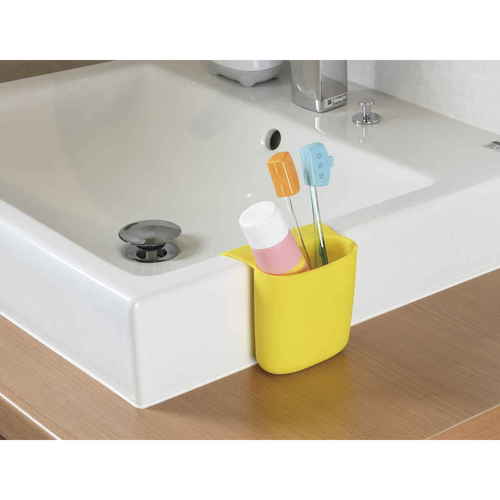 キッチンラック　ペタッとポケットmini　イエロー 全体が黄色でシンプルなデザインの収納ラックが壁に取り付けられ、内部が空になった様子。