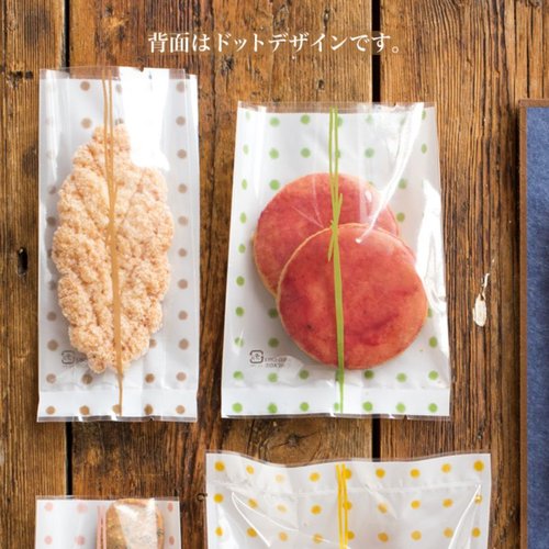 テープ無 OPP袋 和風ドットスイーツパック(桃) クリア-4(100枚) ヘッズ 透明なパッケージに和風ドット模様が施され、果物のイラストが描かれた状態