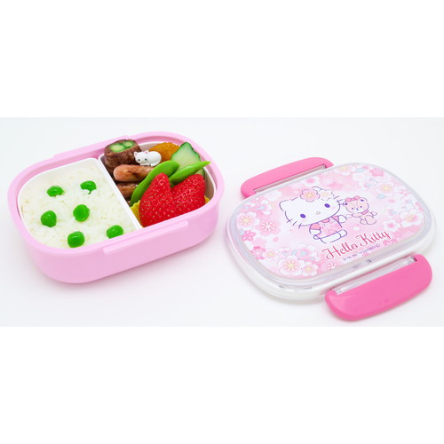 お弁当箱　1段　ハローキティ　サクラ　360ml　中子付　ランチボックス　子供 優しいサクラ色のデザインで、フタにはキャラクターが描かれたお弁当箱が見える状態