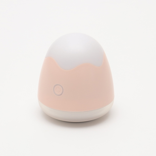 毛玉取り器　オーヴォ　充電式　ピンク ピンクの本体が正面から見える角度で、充電コードが付属している様子。