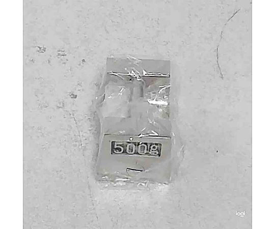枕型分銅 500g 真上から見た平らな重りの表面、均一な質感が際立つ。