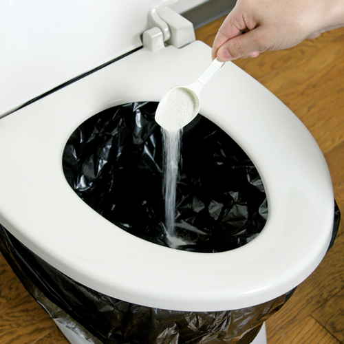 簡易トイレ強力凝固・消臭剤　400g 容器が立てられた状態でラベルが正面に見える