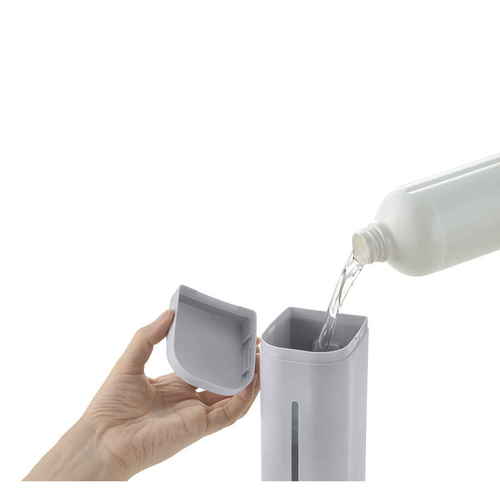 ディスペンサー　泡タイプ　シールフック　下から出てくるディスペンサー　500ml　ホバー　グレー 透明な容器に入った泡タイプのディスペンサーがシールフックに取り付けられ、下から泡が出てくる様子が見える。