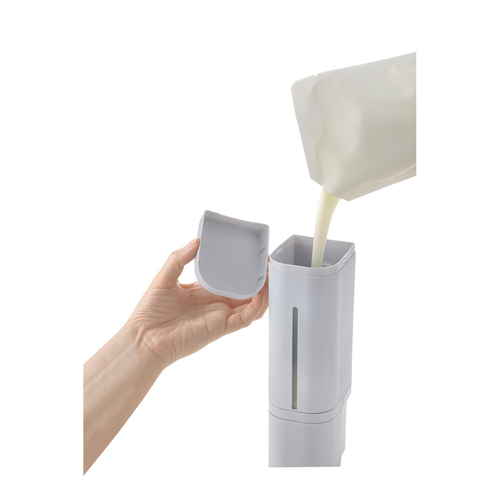 ディスペンサー　マグネット　下から出てくるディスペンサー　500ml　ホバー　グレー マグネット式のディスペンサーが横置きで、下から液体が出る様子が見える状態