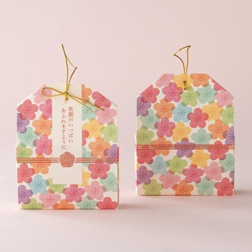 ギフト箱 MSO-CVB1 メッセージお守りカバーバッグ-1/笑顔(20枚) ヘッズ パッケージが正面を向いており、笑顔のイラストがデザインされた状態