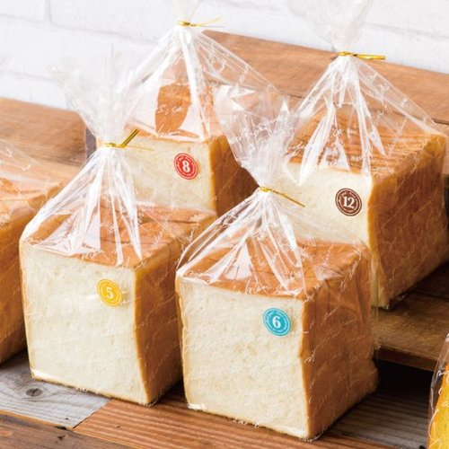 ポリ手提げ NEWフレンチIPP食パンバッグ-1斤(100枚) ヘッズ 透明なポリ袋に密閉された1斤のサイズが見える状態
