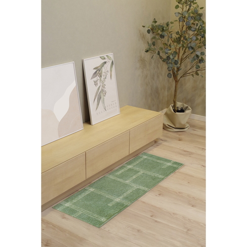 キッチンマット　kietoインテリアマット　45×120cm　グリーン 緑色のマットが床に敷かれた状態で、周囲に家具が配置されている様子。