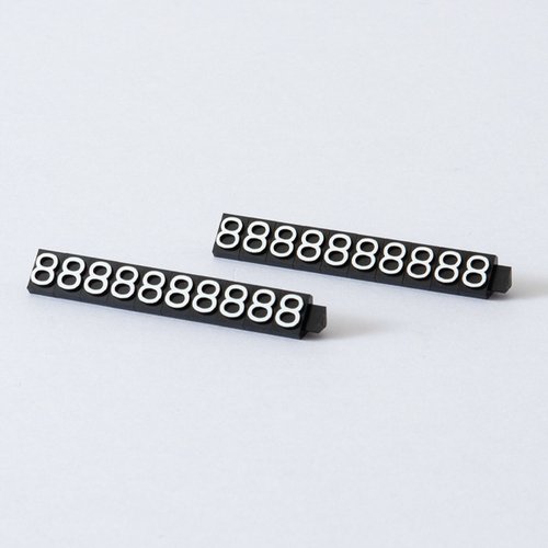 陳列備品 ニュープライスキューブ補充L用(20粒) 黒/白 8 友屋 黒と白の色分けされた補充用品が整然と並んでいる様子