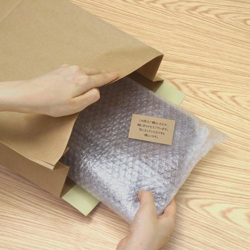 梱包用品 32-1493 宅配袋 未晒 260×80×320 10枚入 ササガワ 無地の宅配袋が横向きに並んでいる様子