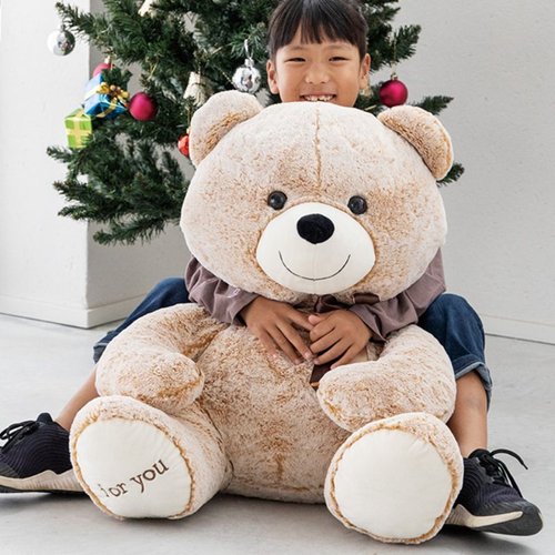 贈答用飾り 抱キツキアニマル クマノマックス-3(1個) ヘッズ ぬいぐるみの側面が見える状態、柔らかな毛並みと愛らしい表情。