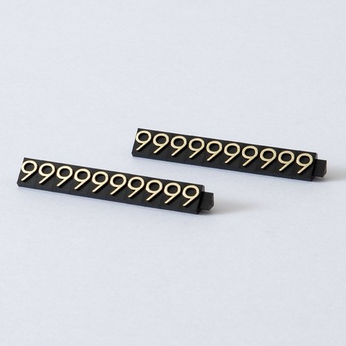 陳列備品 ニュープライスキューブ補充L用(20粒) 黒/金 9 友屋 黒と金のカラーパターンのパッケージが整然と並んだ様子