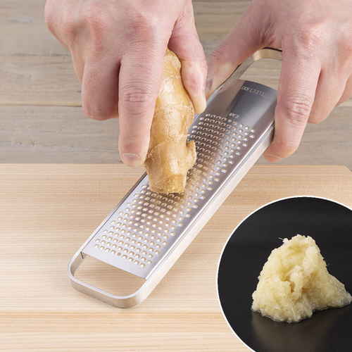 グレーター　SELECT100　カバー付き　おろし器 透明カバーが付いた状態でスタンドに置かれたおろし器