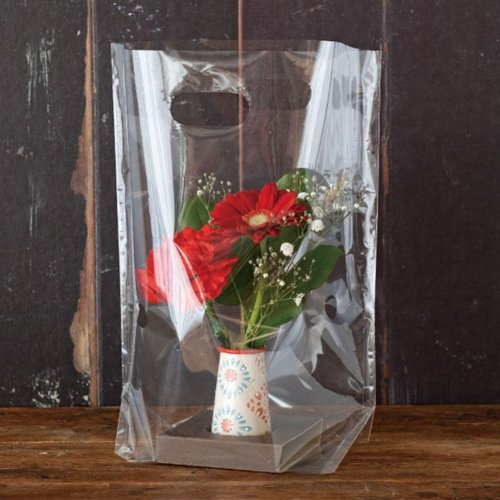 フラワー什器 ハンドメイドプリントフラワーベース-11(12個) ヘッズ カラフルな花柄がデザインされた円筒形のベースの上部が見える状態