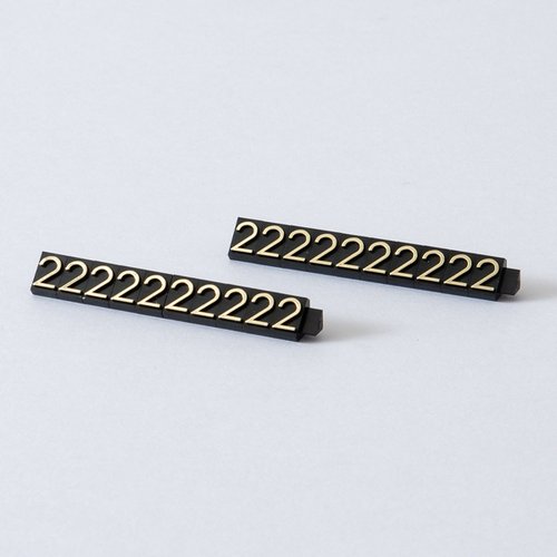 陳列備品 ニュープライスキューブ補充L用(20粒) 黒/金 2 友屋 黒と金のコントラストが際立つパッケージが正面から見える状態